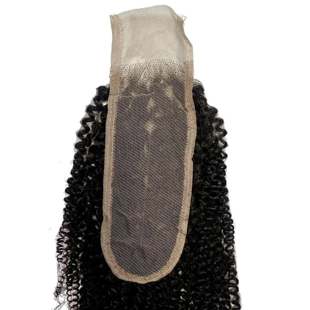 Afro kinky 2x6 transparent lace human hair closure from THE HAIR PUSHER PREMIUM LUXE HAIR, showing detailed lace and kinky curl texture.