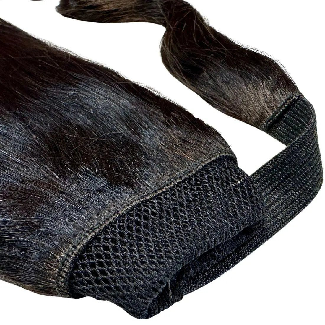 Natural black 100% human hair ponytail extension from THE HAIR PUSHER PREMIUM LUXE HAIR, showing the sleek, shiny ponytail style.