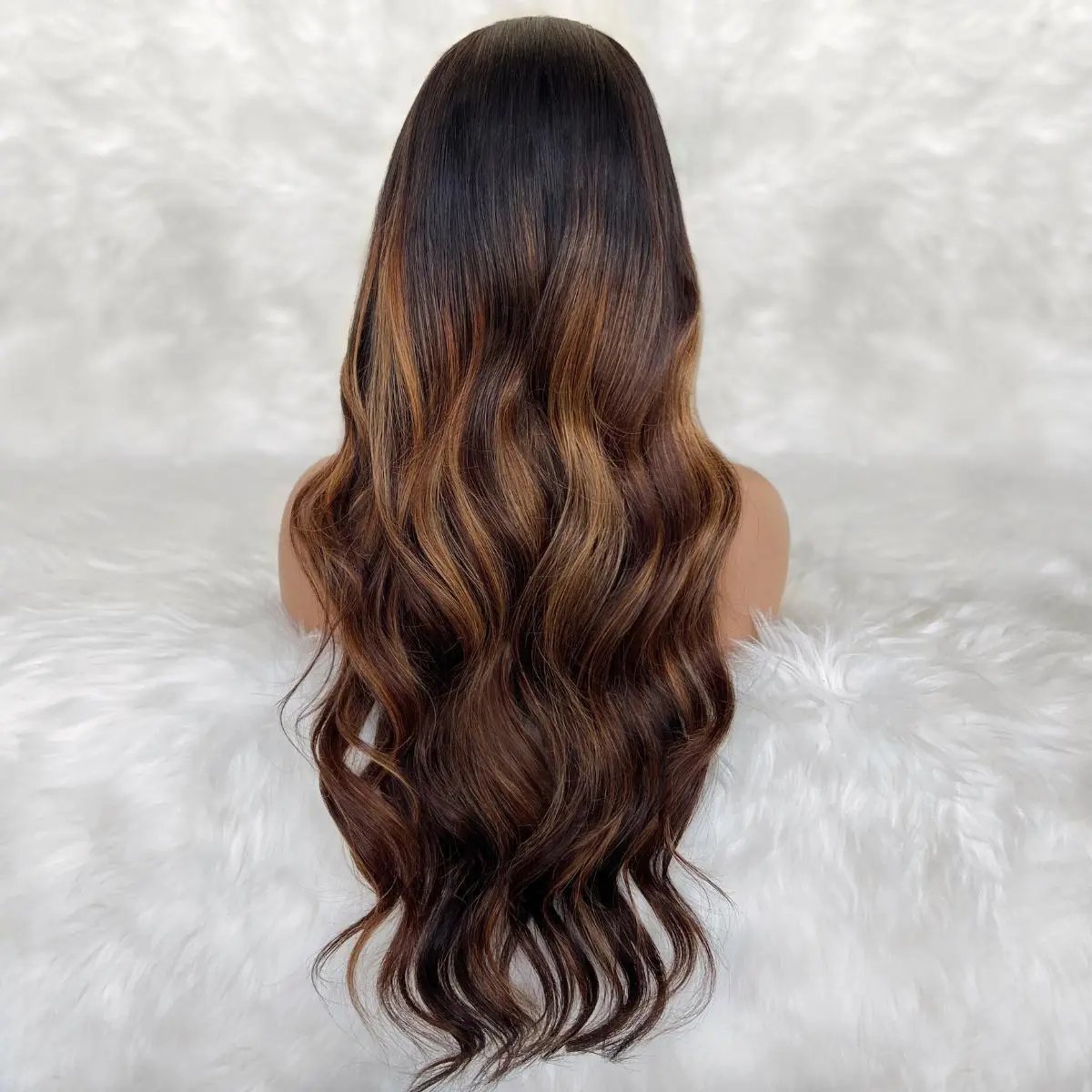 A back view of THE HAIR PUSHER PREMIUM LUXE HAIR Ava glueless 5x5 HD lace human hair closure wig in natural color.