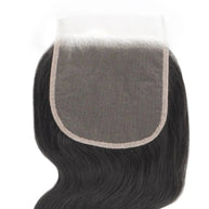 Body Wave 5x5 transparent lace human hair closure by THE HAIR PUSHER PREMIUM LUXE HAIR, shown from the back.
