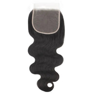 Body Wave 5x5 transparent lace human hair closure by THE HAIR PUSHER PREMIUM LUXE HAIR, showcasing the natural wave pattern and lace detail.