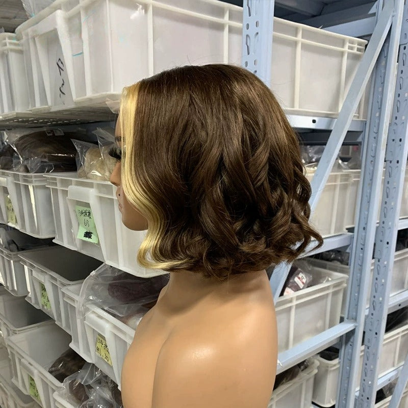 Honey Blonde 12-inch The Heiress lace front human hair bob wig by THE HAIR PUSHER PREMIUM LUXE HAIR, showcasing its transparent lace front.