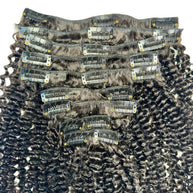 Jerry curl clip-in hair extensions by THE HAIR PUSHER PREMIUM LUXE HAIR, showing the natural curly 100% human hair strands.