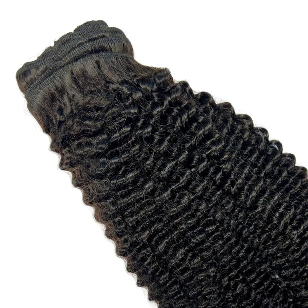 Jerry curl clip-in hair extensions by THE HAIR PUSHER PREMIUM LUXE HAIR, 100% human hair, shown with clips attached.
