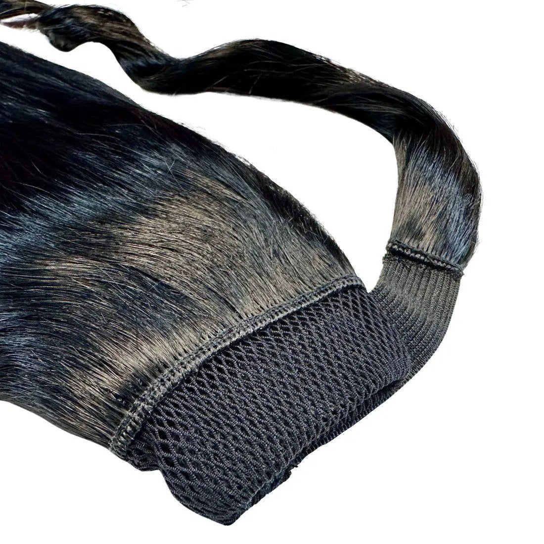 Jet black 100% human hair ponytail extension with cuff from THE HAIR PUSHER PREMIUM LUXE HAIR, styled in a sleek, natural look.