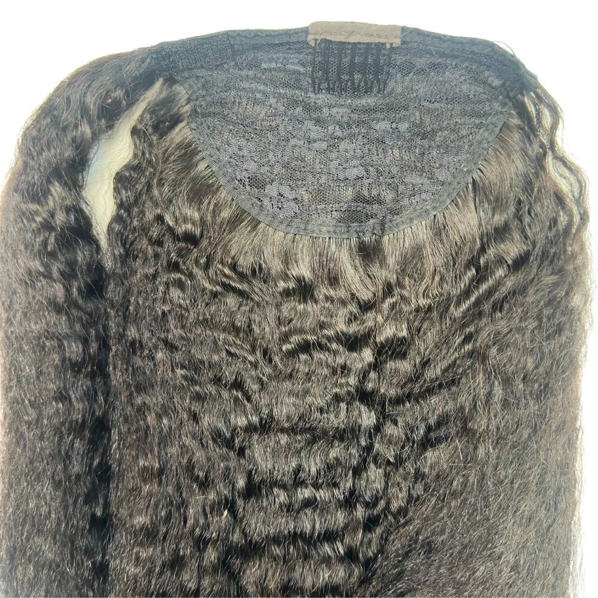 Kinky straight 100% human hair ponytail extension from THE HAIR PUSHER PREMIUM LUXE HAIR, shown attached to a model's back.