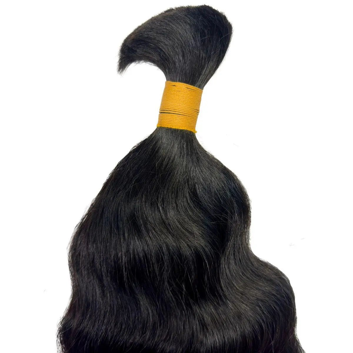 Close-up of raw Indian curly braiding hair extension in bulk from THE HAIR PUSHER PREMIUM LUXE HAIR, showcasing its texture and color.