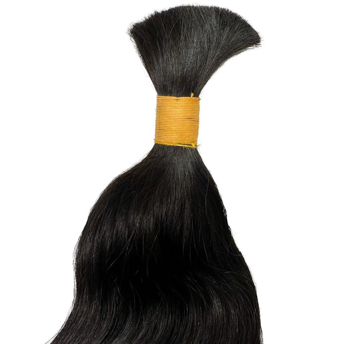 Raw Indian wavy bulk human hair extensions by THE HAIR PUSHER PREMIUM LUXE HAIR, showing soft, natural wavy texture and thickness.