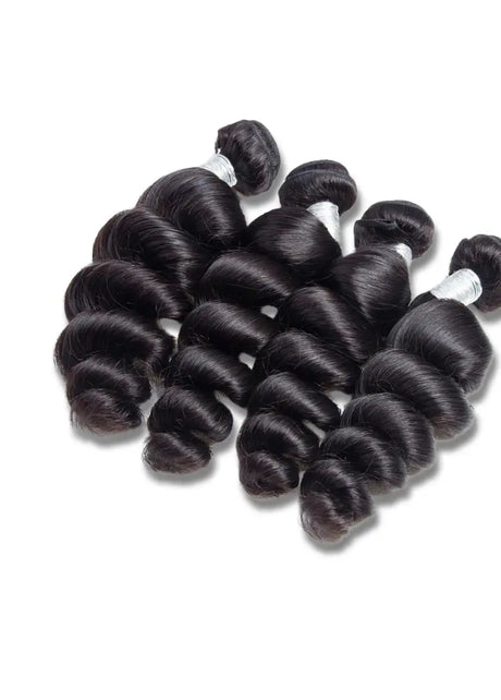 Luxury Loose Wave Brazilian hair bundles from The Hair Pusher, showcasing soft, flowing loose wave texture and natural shine.