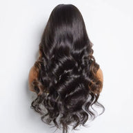 Velvet loose wave HD wig by THE HAIR PUSHER featuring soft, flowing wavy hair with a natural shine and full volume.