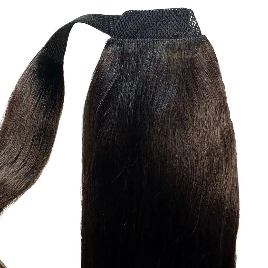 Natural black 100% human hair ponytail extension from THE HAIR PUSHER PREMIUM LUXE HAIR, showing sleek, shiny hair extension attached.