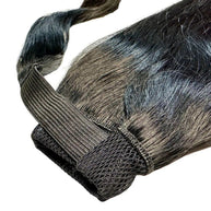 Jet black 100% human hair ponytail extension from THE HAIR PUSHER PREMIUM LUXE HAIR, showcasing a sleek, smooth ponytail style.