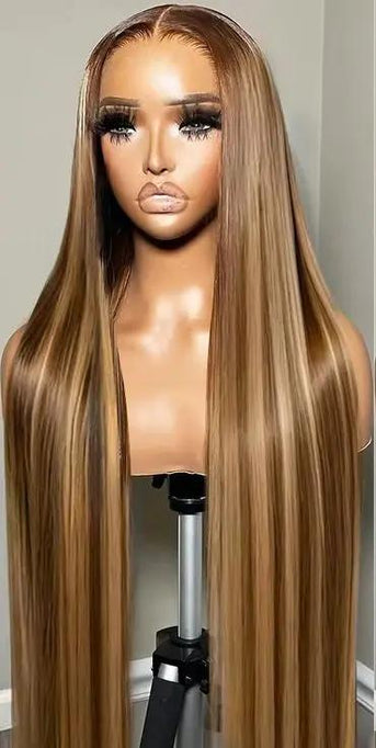 Blonde ombré highlight bone straight HD lace wig from THE HAIR PUSHER PREMIUM LUXE HAIR, showcasing smooth, sleek hair with natural shine.