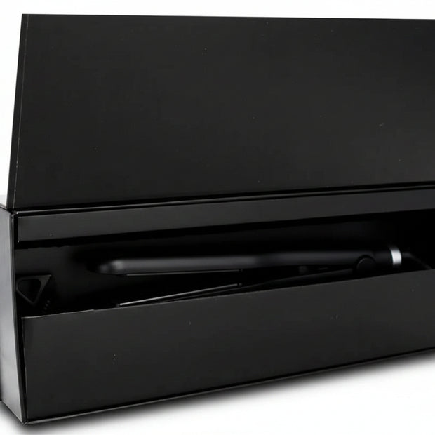 1-inch titanium flat iron by THE HAIR PUSHER PREMIUM LUXE HAIR, a professional hair styling tool with sleek titanium plates.